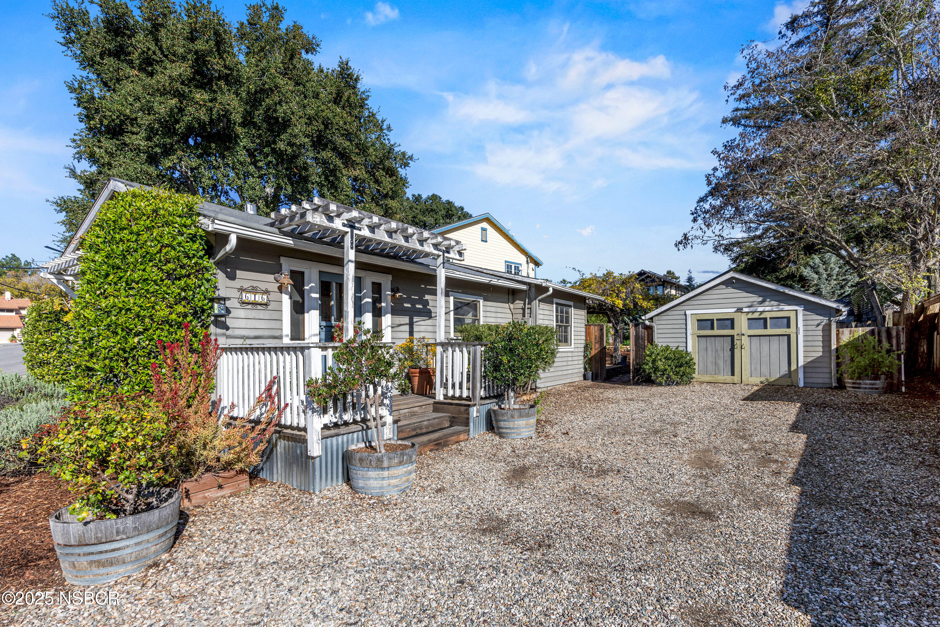 616 Alisal Road Solvang, CA 93463 - Photo 29 of 35 a view of a house with a yard and garden