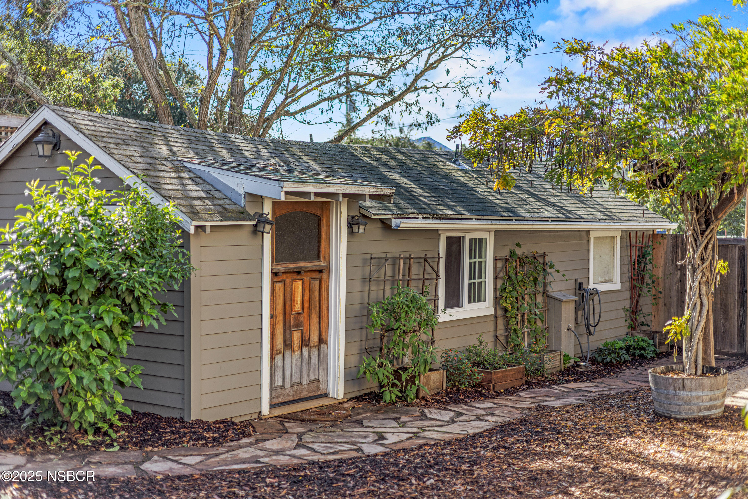 616 Alisal Road Solvang, CA 93463 - Photo 33 of 35 a front view of a house with garden