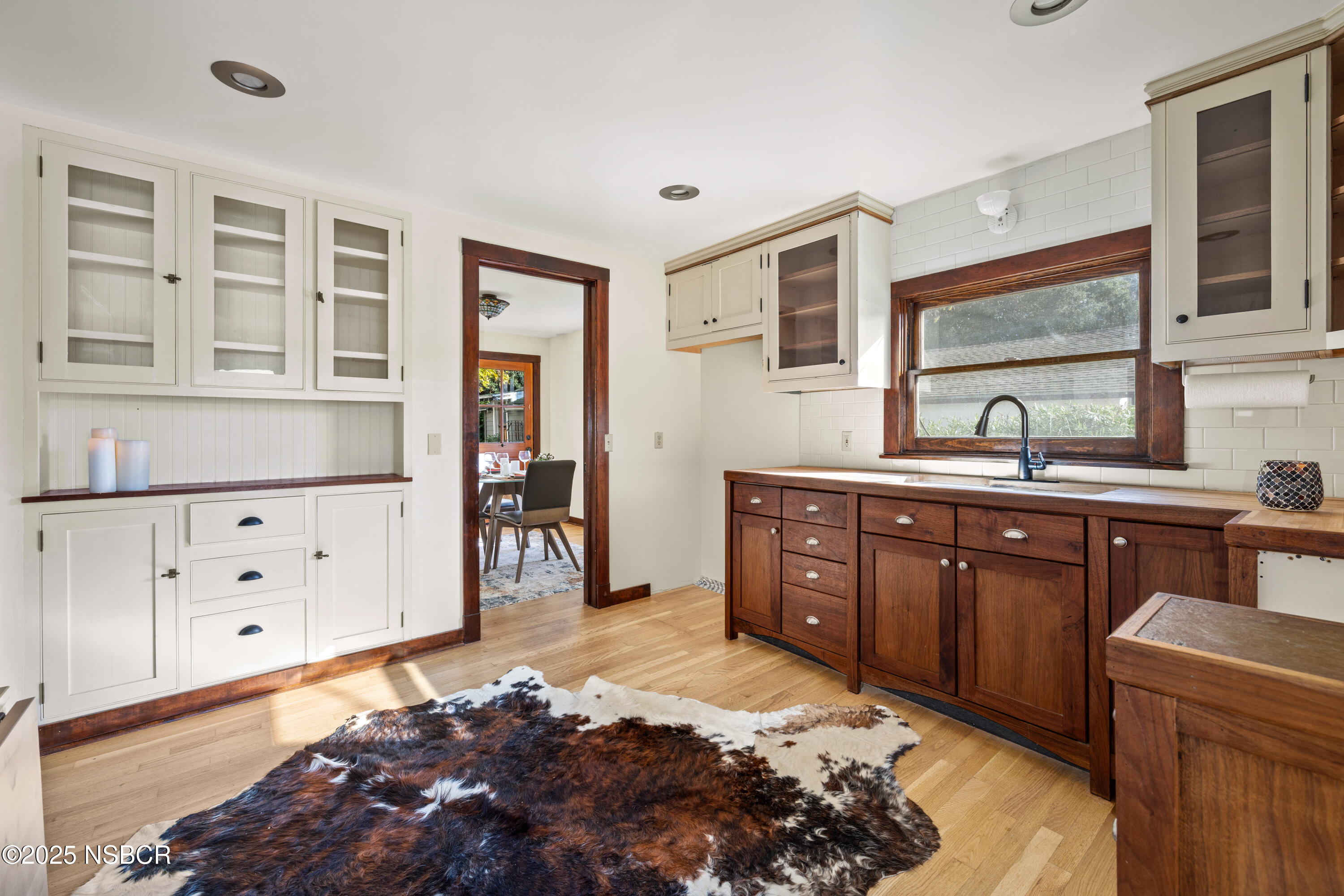 616 Alisal Road Solvang, CA 93463 - Photo 4 of 35 a bedroom with a bed and wooden floor