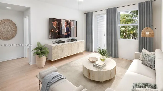 a living room with furniture and a potted plant