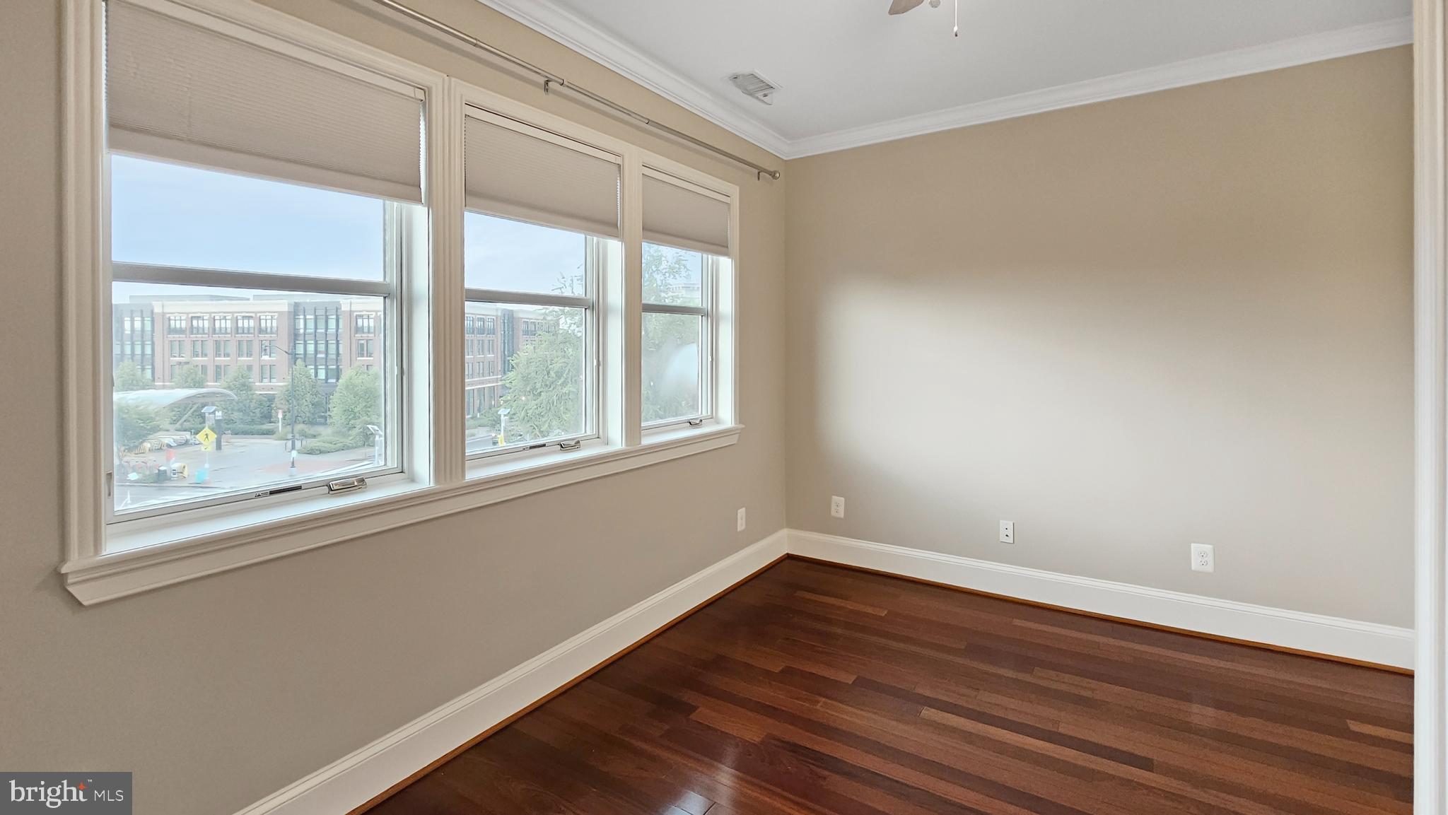 1834 Massachusetts Avenue Southeast Washington, DC 20003 - Photo 14 of 25 a view of an empty room with wooden floor and a window
