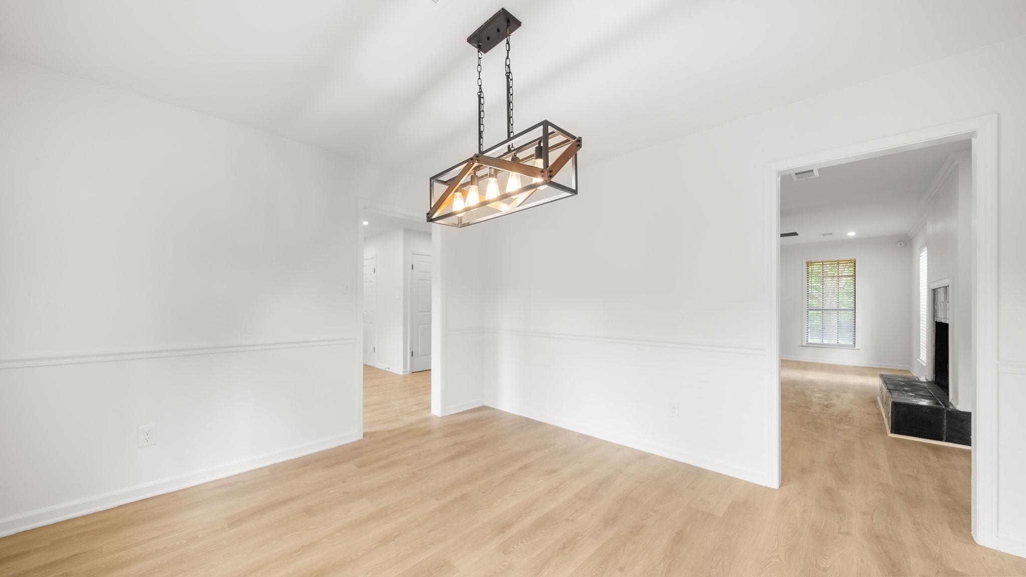 4351 Spring Oak Cove Memphis, TN 38125 - Photo 13 of 40 a view of empty room with wooden floor and fan