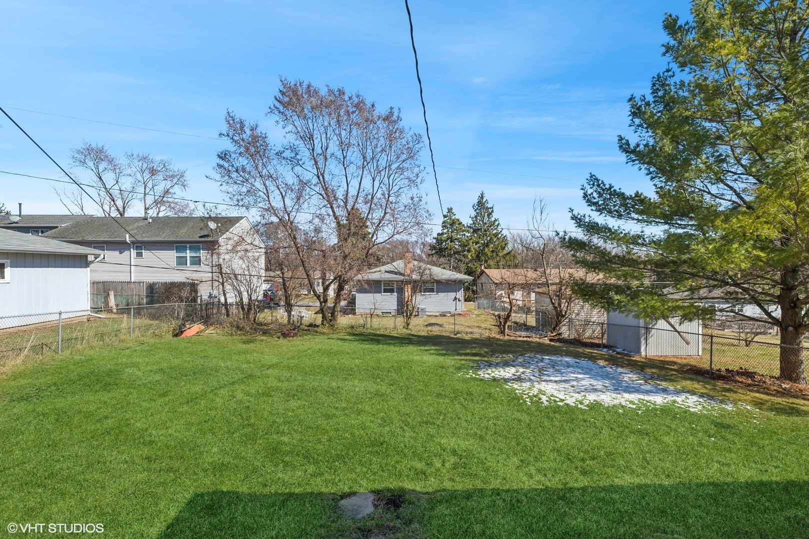5414 Thelen Drive McHenry, IL 60051 - Photo 14 of 18 a view of a yard with a house in the background
