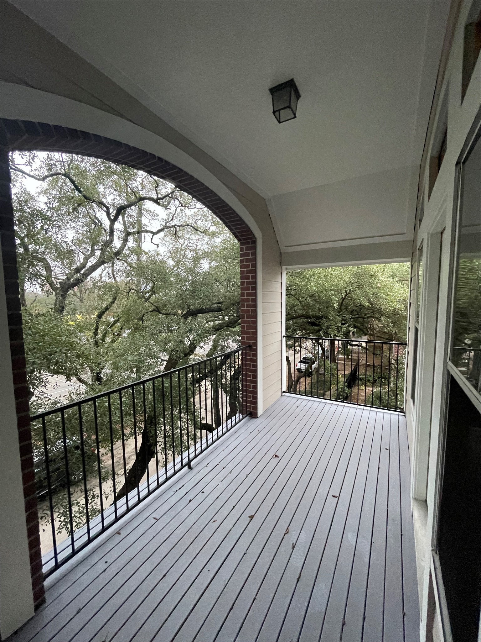 1040 La Rue Street Houston, TX 77019 - Photo 10 of 29 a view of balcony with wooden floor