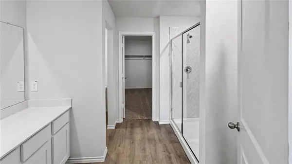 a view of a bathroom from a hallway