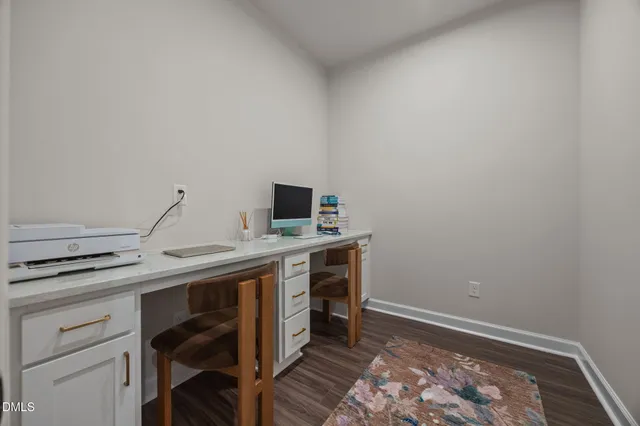 a room with a table and chairs