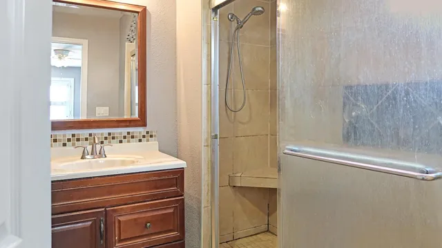 a bathroom with a sink and a mirror