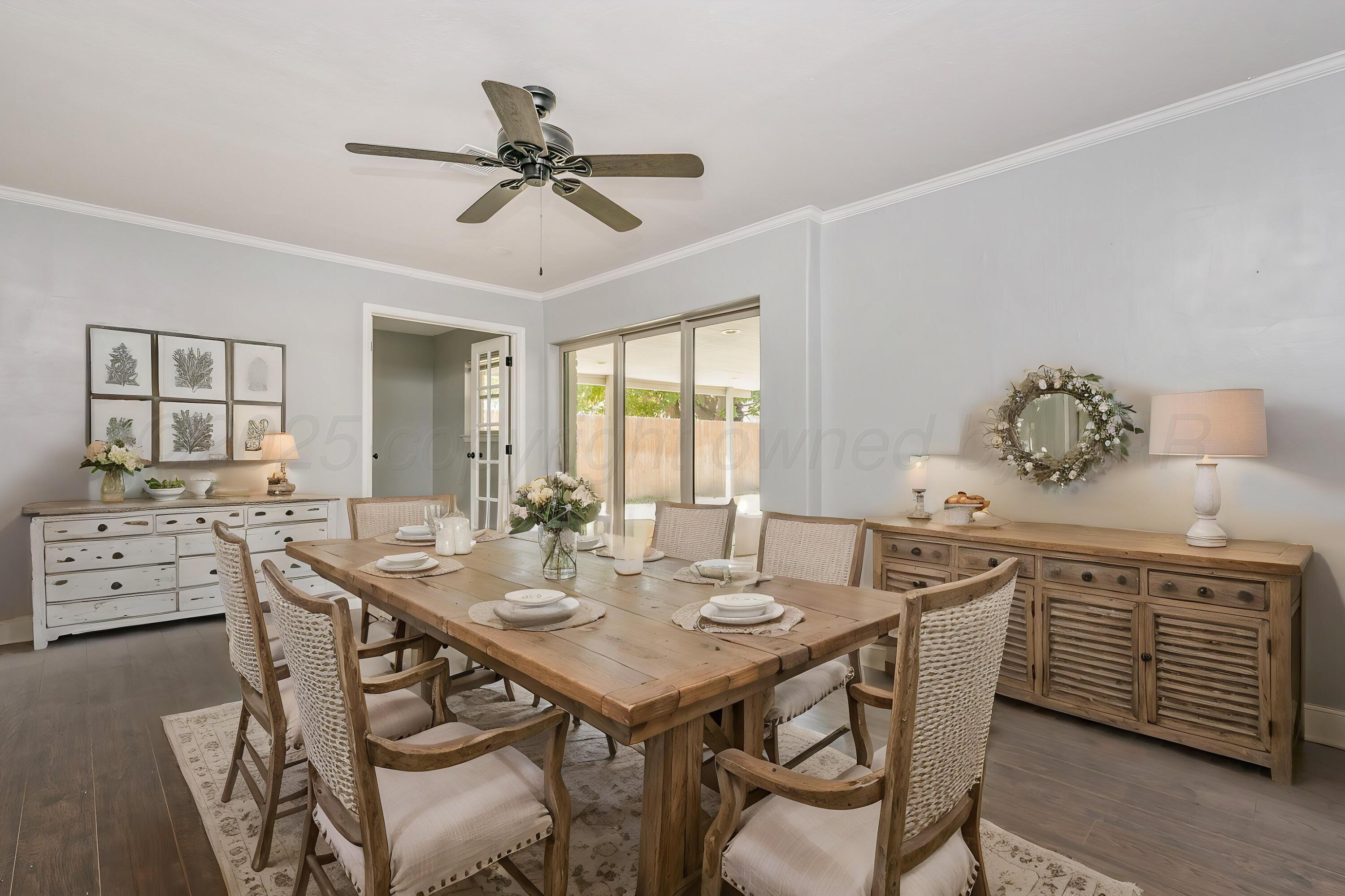 6218 Adirondack Trail Amarillo, TX 79106 - Photo 11 of 26 a view of a dining room with furniture window and wooden floor