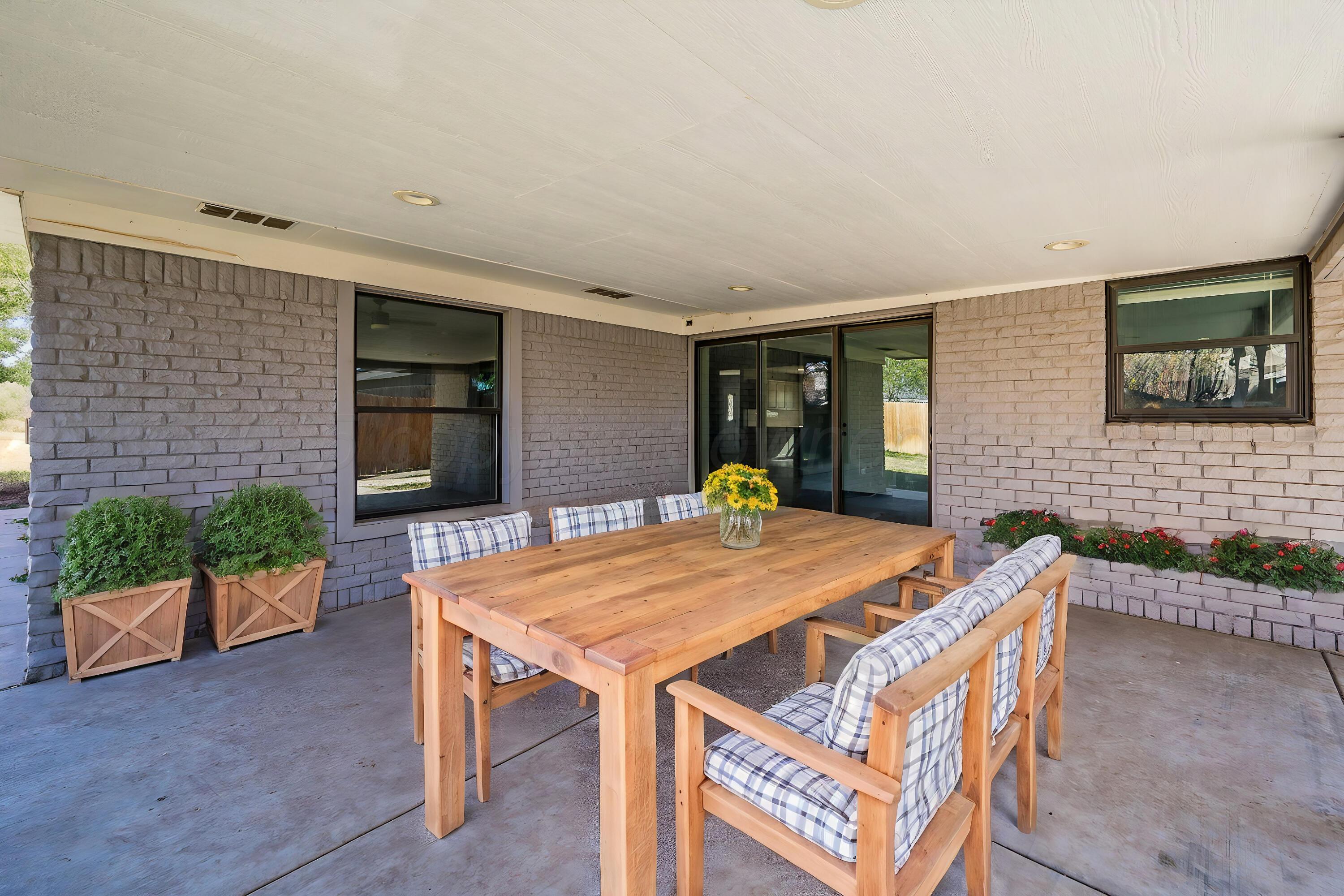 6218 Adirondack Trail Amarillo, TX 79106 - Photo 22 of 26 a view of an outdoor space with a table and chairs
