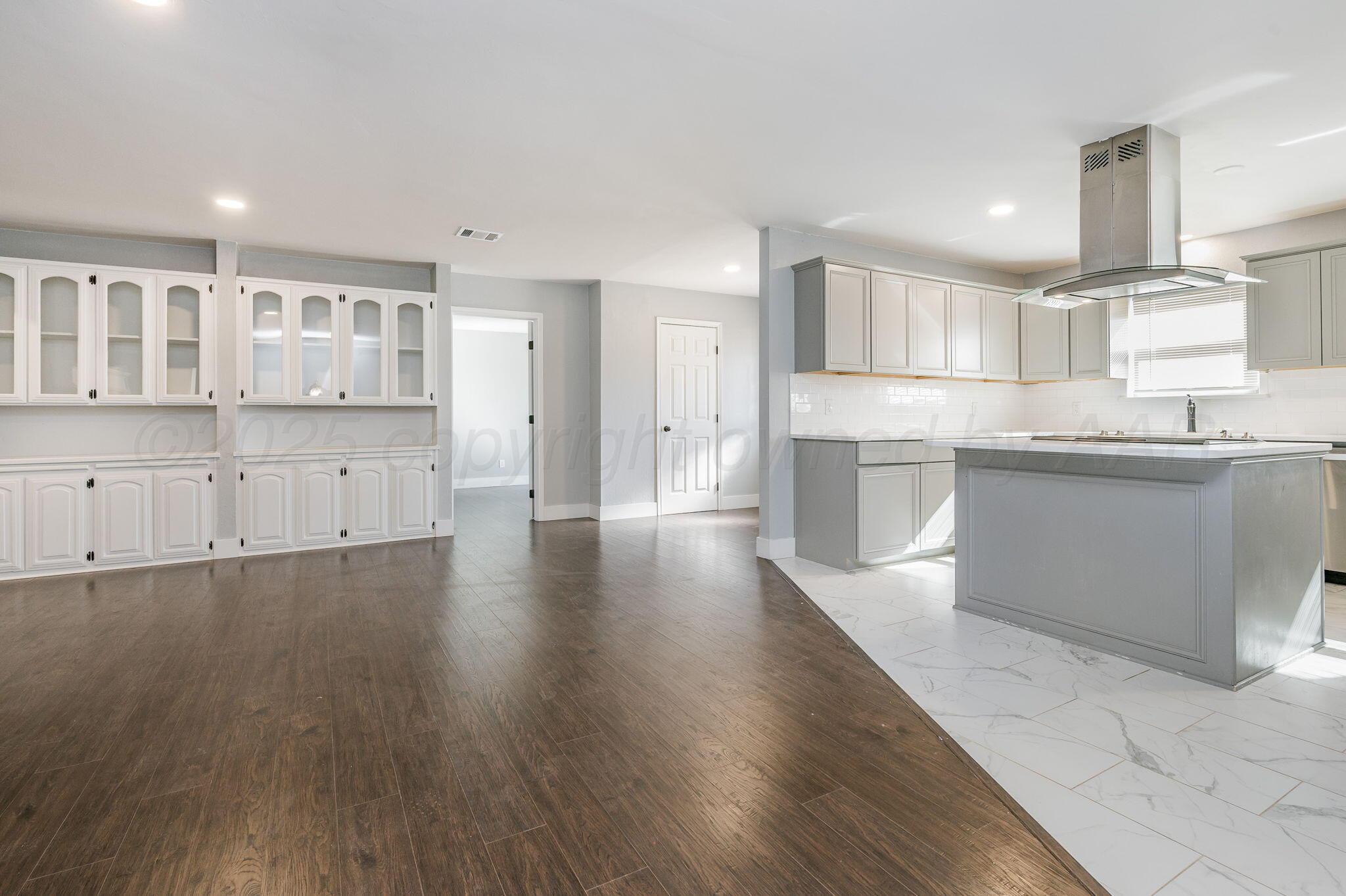6218 Adirondack Trail Amarillo, TX 79106 - Photo 6 of 26 a kitchen with stainless steel appliances granite countertop a sink and cabinets