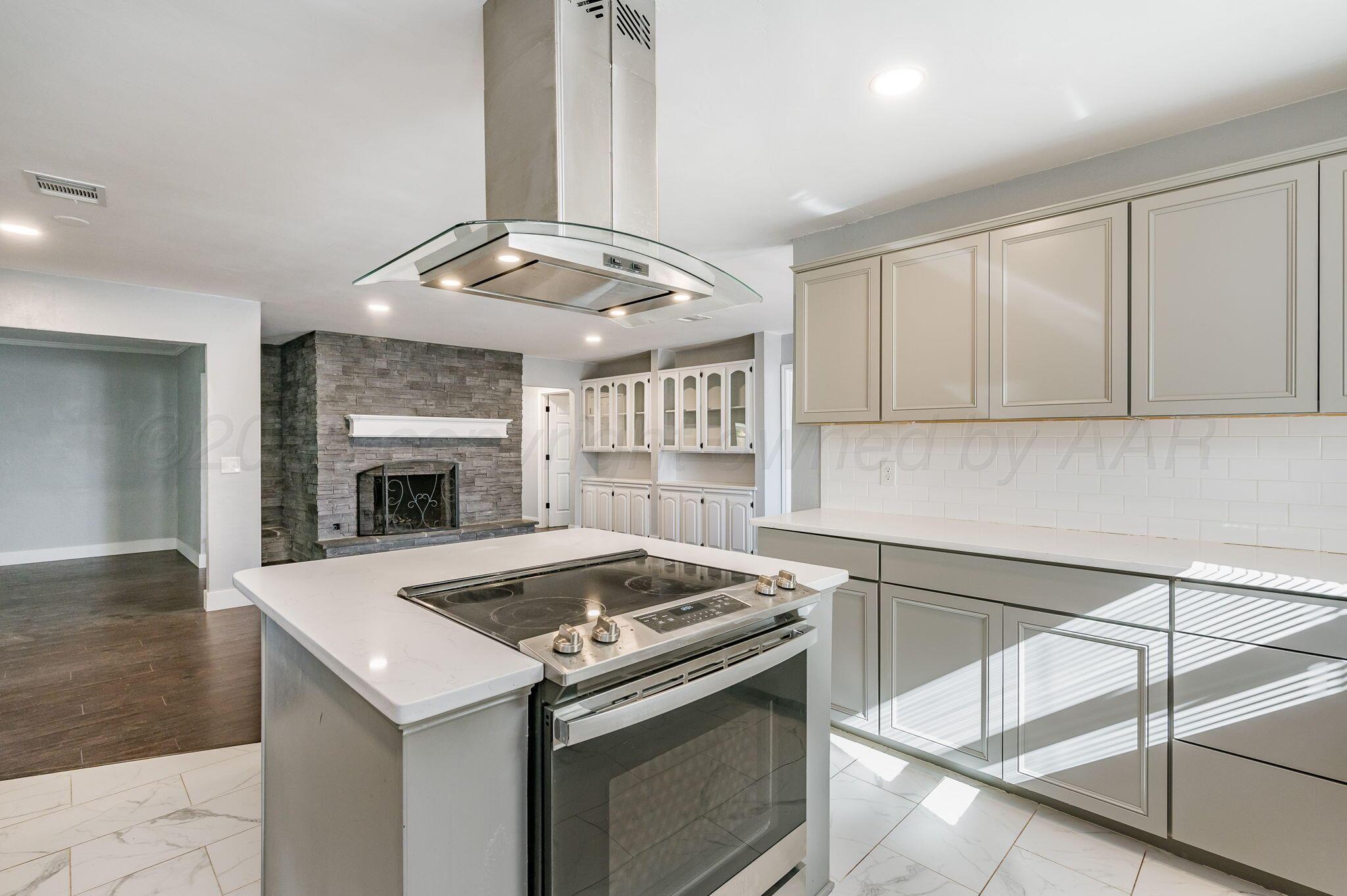 6218 Adirondack Trail Amarillo, TX 79106 - Photo 7 of 26 a kitchen with a stove and a sink