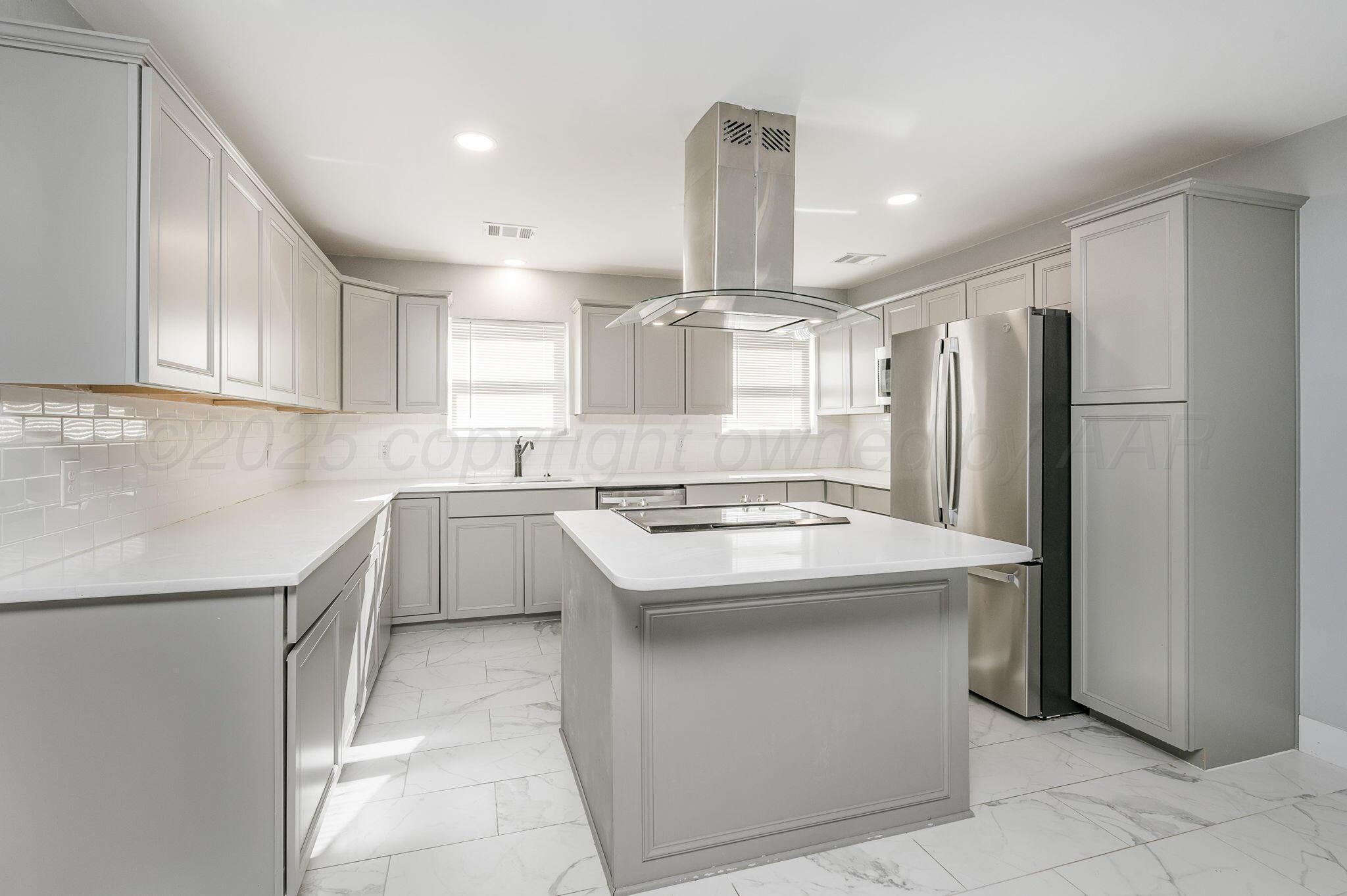 6218 Adirondack Trail Amarillo, TX 79106 - Photo 8 of 26 a kitchen with a sink appliances and cabinets