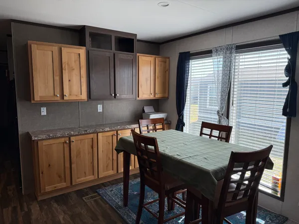 a view of a room with wooden floor