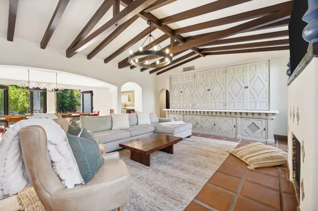 a view of a dining room with furniture and chandelier