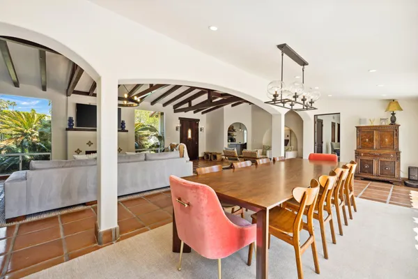 a view of a house with swimming pool and sitting area