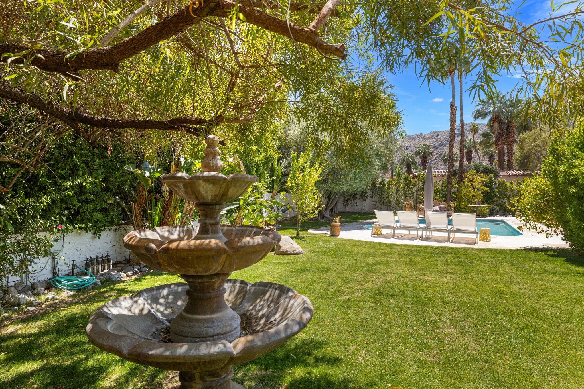 435 West Vereda Sur Palm Springs, CA 92262 - Photo 29 of 80 a view of a fountain in the backyard of house