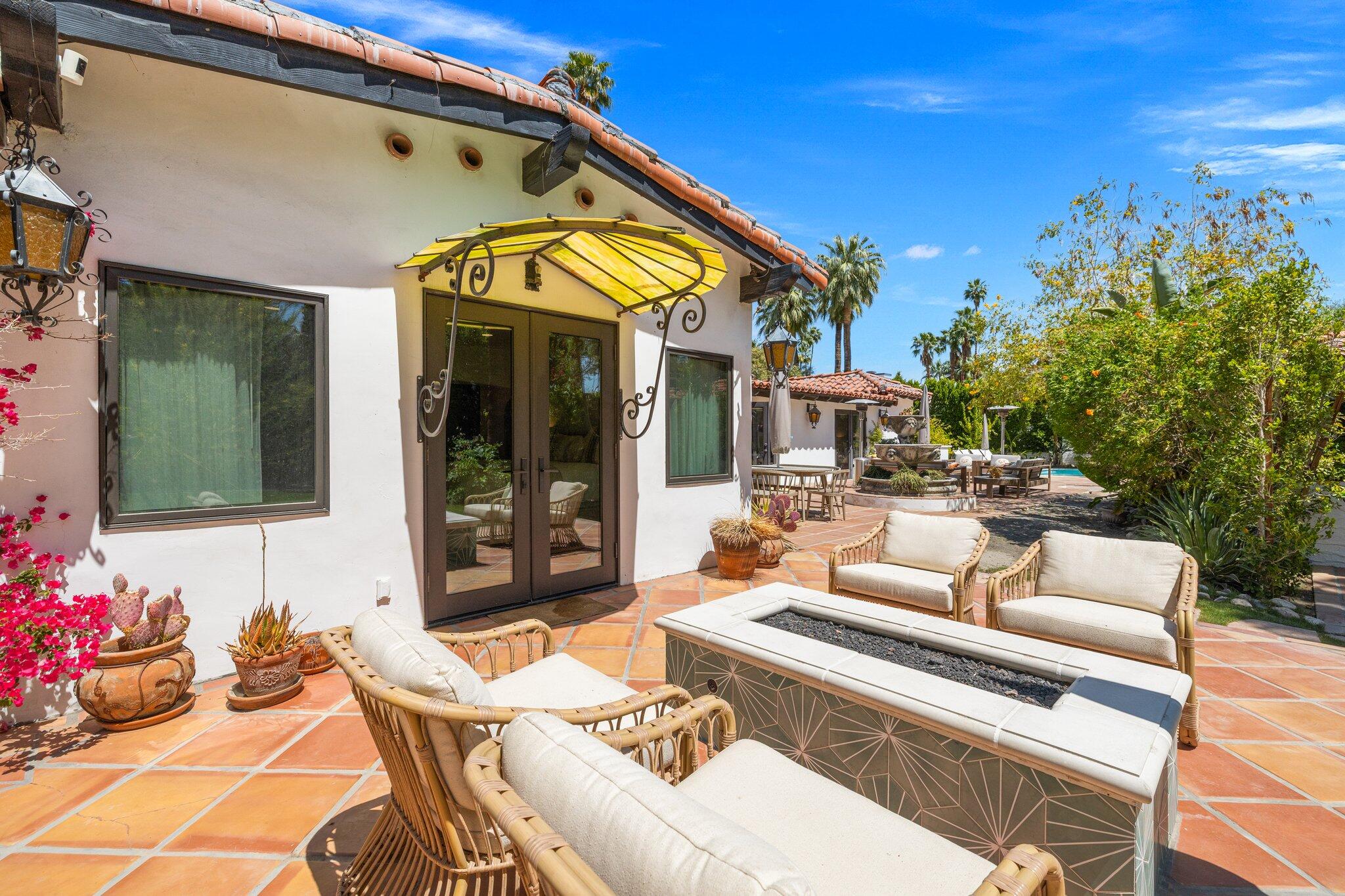 435 West Vereda Sur Palm Springs, CA 92262 - Photo 37 of 80 a view of a patio with couches table and chairs and potted plants
