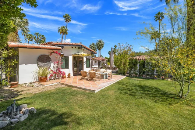 a bathroom with a double vanity sink mirror and bathtub