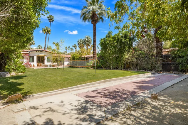 a bed sitting in a room next to a window
