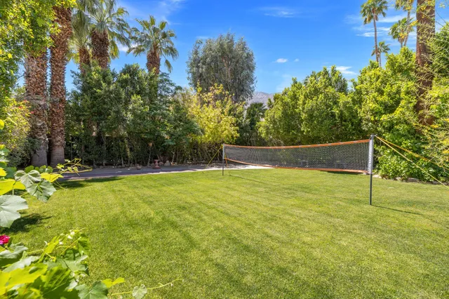 an aerial view of a house with yard swimming pool and outdoor seating