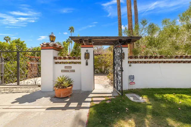 a front view of a house with lake view and a yard