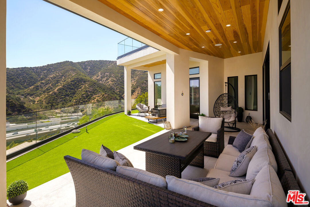 1367 Casiano Road Los Angeles, CA 90049 - Photo 24 of 26 a outdoor living space with furniture and garden view