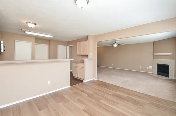 a kitchen with a refrigerator stove top oven and sink