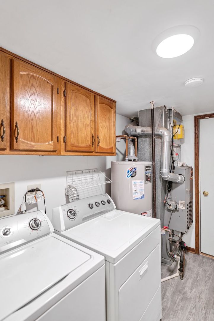 2116 Glasgow Court, Unit 2116 Hanover Park, IL 60133 - Photo 17 of 29 a utility room with dryer and washer