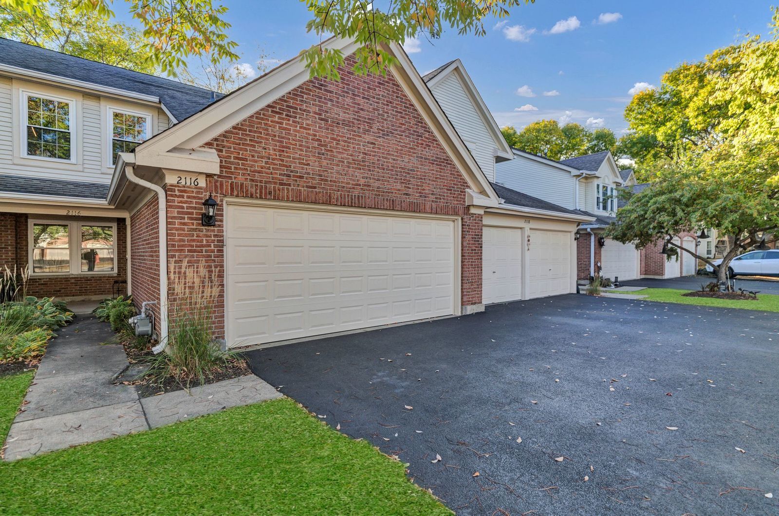 2116 Glasgow Court, Unit 2116 Hanover Park, IL 60133 - Photo 2 of 29 a view of a house with a yard