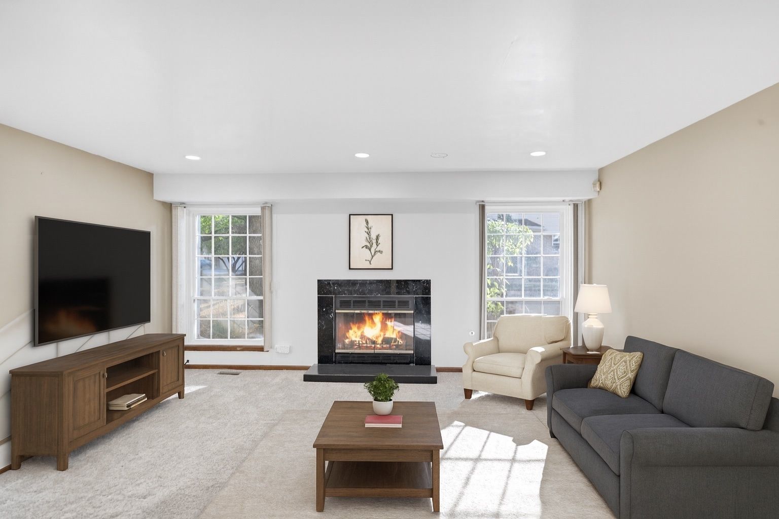 2116 Glasgow Court, Unit 2116 Hanover Park, IL 60133 - Photo 6 of 29 a living room with furniture and a flat screen tv