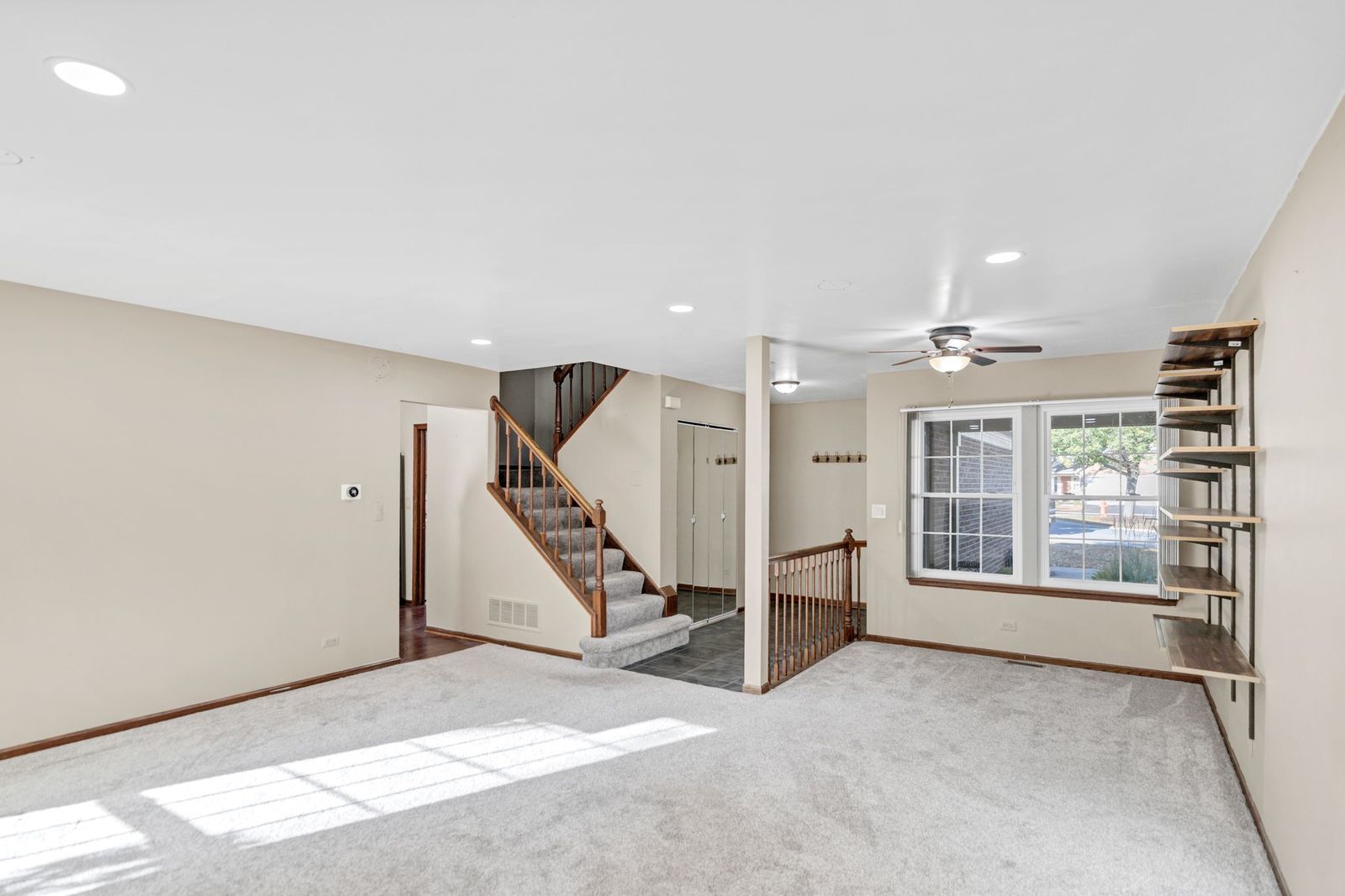 2116 Glasgow Court, Unit 2116 Hanover Park, IL 60133 - Photo 8 of 29 a view of an empty room with a window