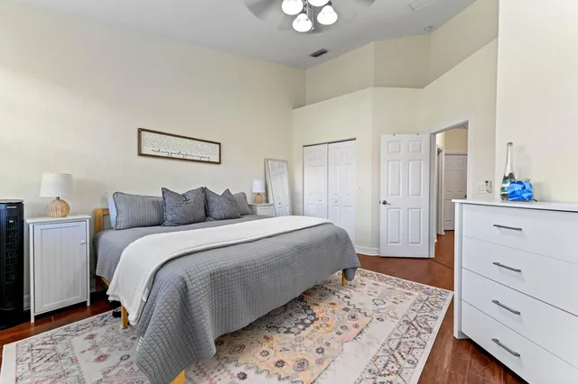 a bedroom with a bed and a dresser