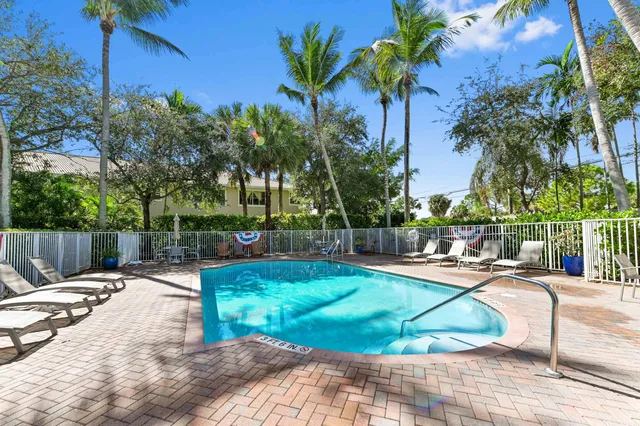 a view of a swimming pool with a lounge chairs