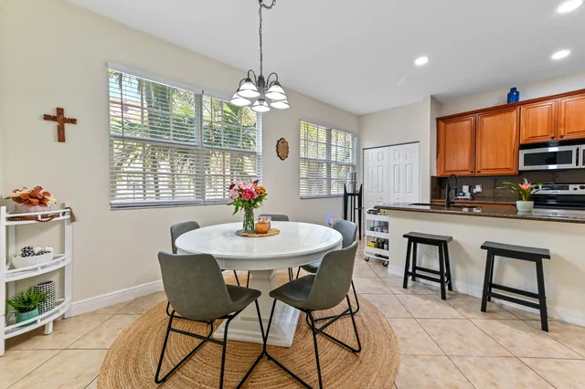 a view of a dining room with furniture window and outside view