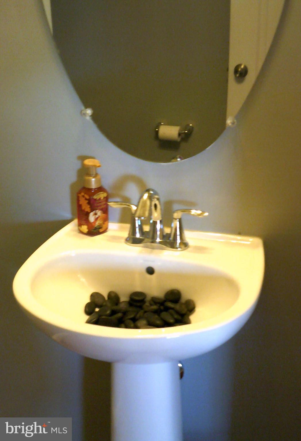 8708 Sagebrush Lane Laurel, MD 20724 - Photo 11 of 29 a bathroom with a sink