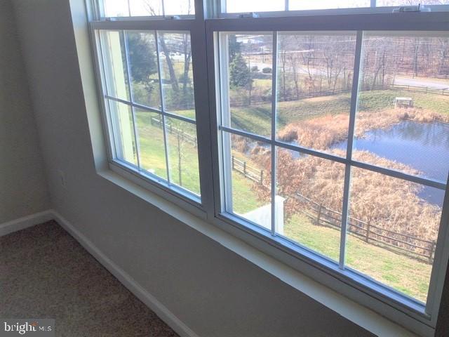 8708 Sagebrush Lane Laurel, MD 20724 - Photo 29 of 29 a view of an empty room with wooden floor and a window