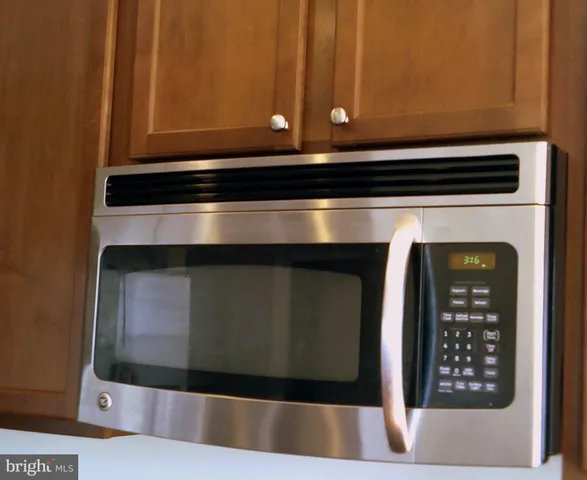 a close view of a stove top oven sitting inside of a kitchen