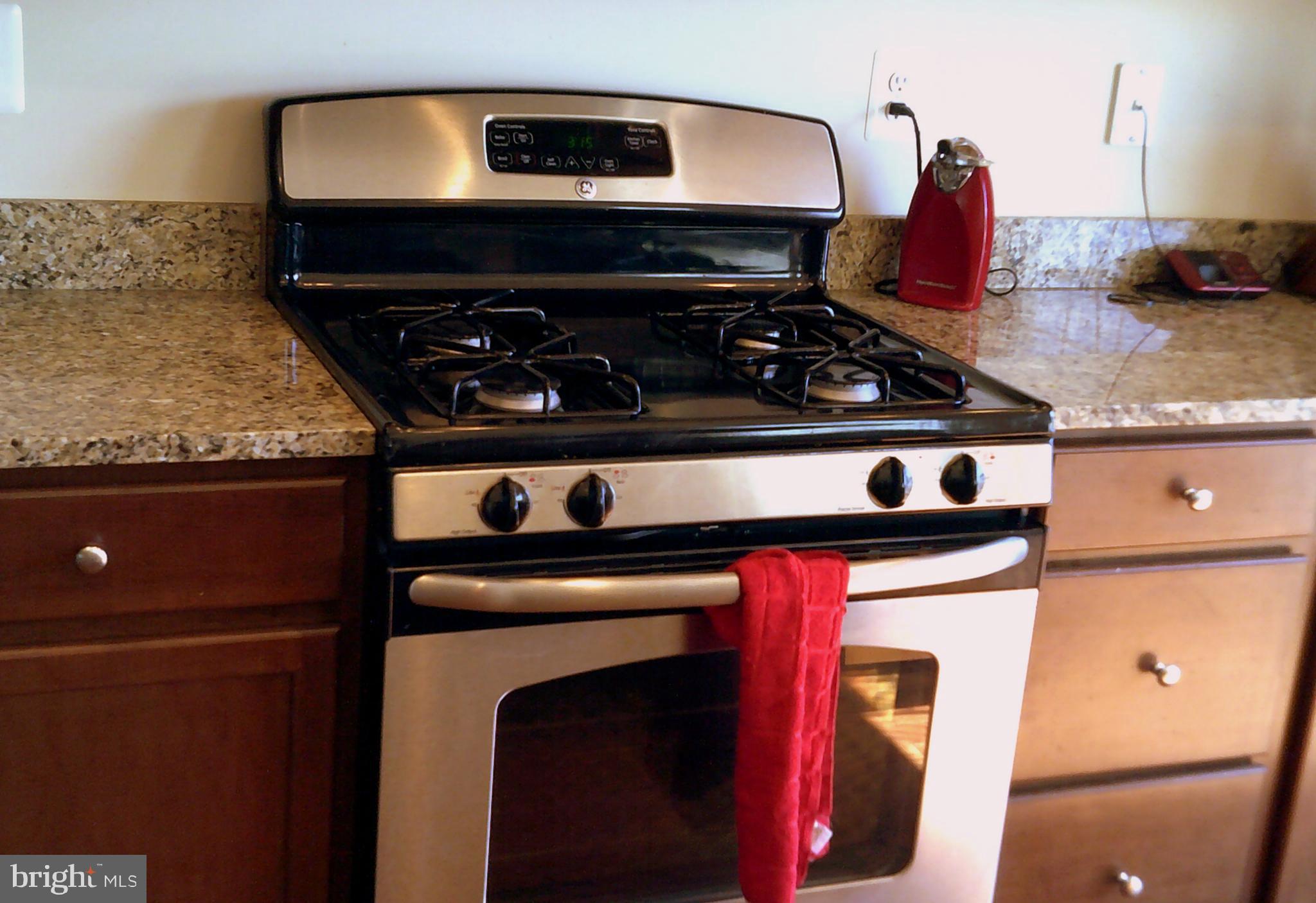 8708 Sagebrush Lane Laurel, MD 20724 - Photo 5 of 29 a close view of a stove top oven sitting inside of a kitchen