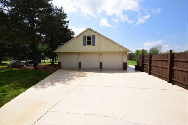 5129 Baker Road Murfreesboro, TN 37129 - Photo 19 of 20 This detached 3 car garage features steps to extra storage!