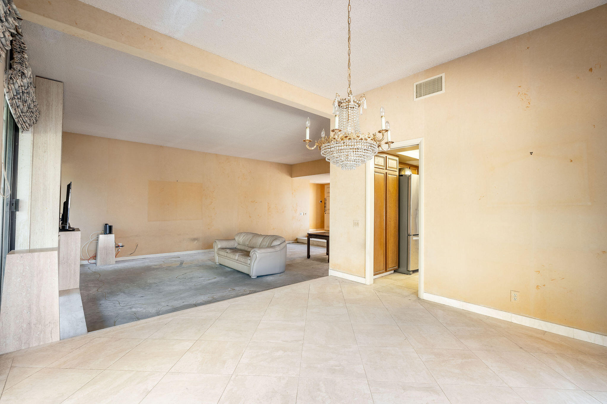 62 Sierra Madre Way Rancho Mirage, CA 92270 - Photo 12 of 46 a spacious bedroom with a bed and a chandelier