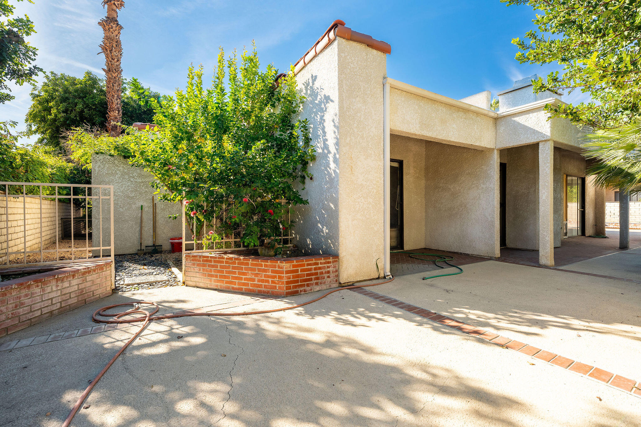 62 Sierra Madre Way Rancho Mirage, CA 92270 - Photo 40 of 46 a view of a house with a yard and tree