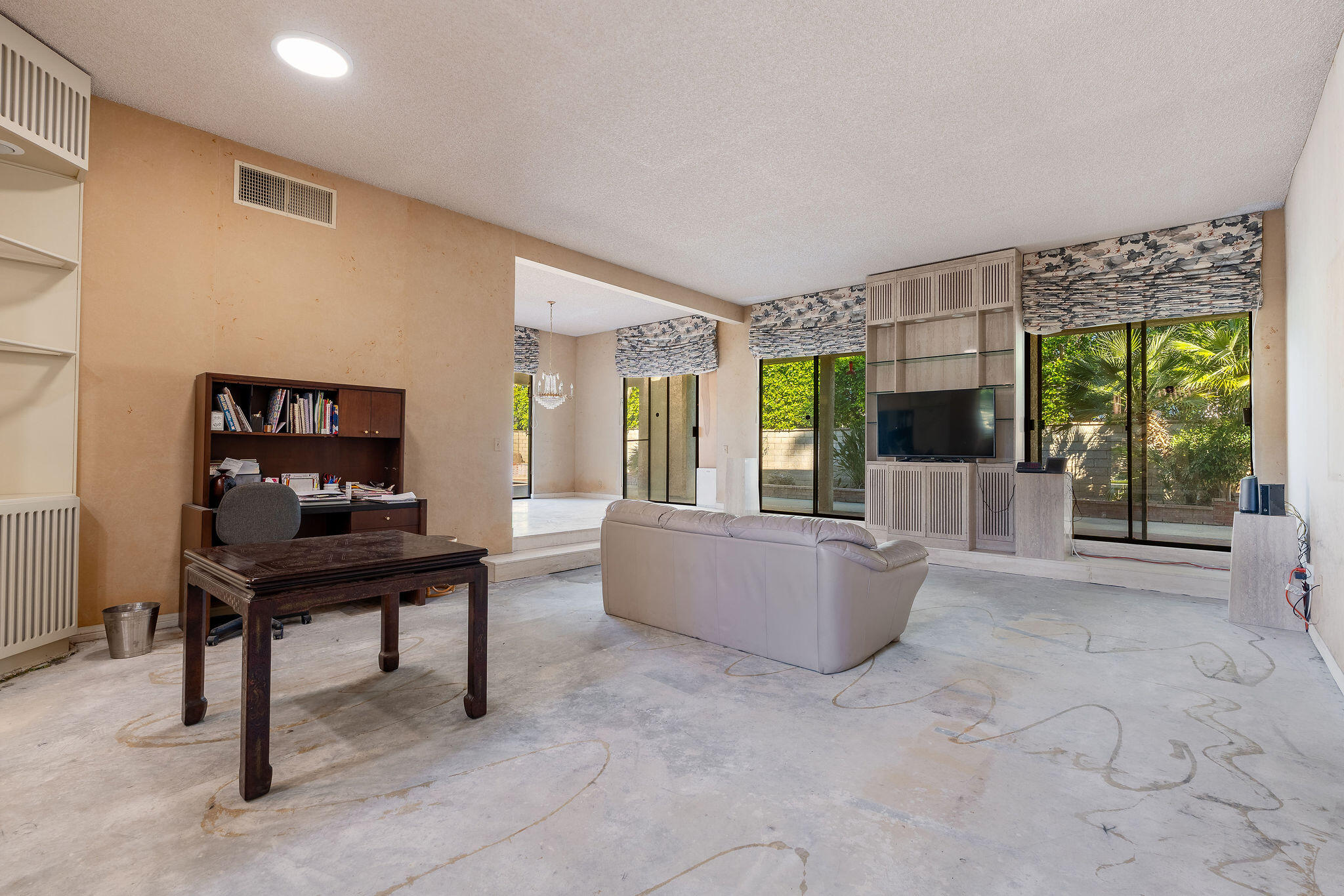 62 Sierra Madre Way Rancho Mirage, CA 92270 - Photo 6 of 46 a living room with furniture and a floor to ceiling window