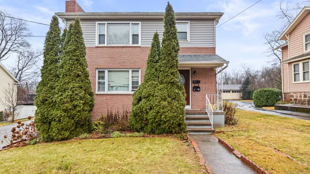 a front view of house with yard