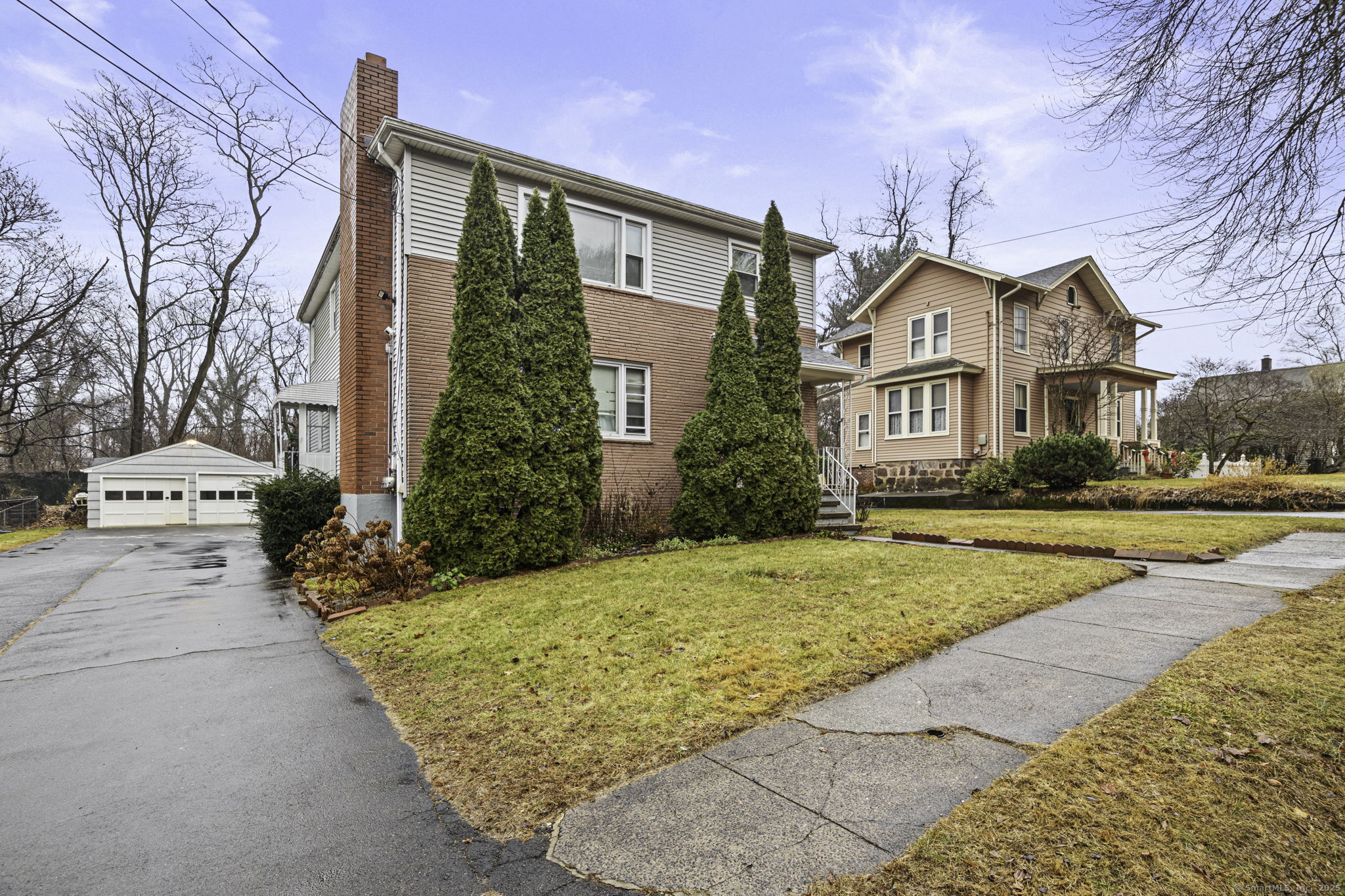 65 1st Avenue, Unit 2 New Haven, CT 06513 - Photo 2 of 13 a front view of a house with a yard and garage