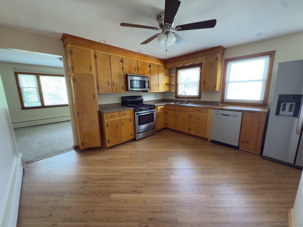 65 1st Avenue, Unit 2 New Haven, CT 06513 - Photo 3 of 13 a large kitchen with stainless steel appliances granite countertop a stove a sink dishwasher and a refrigerator