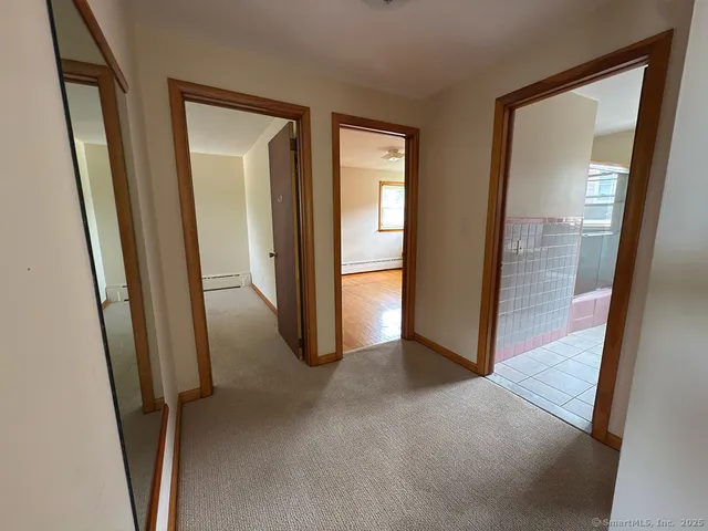 an empty room with mirror