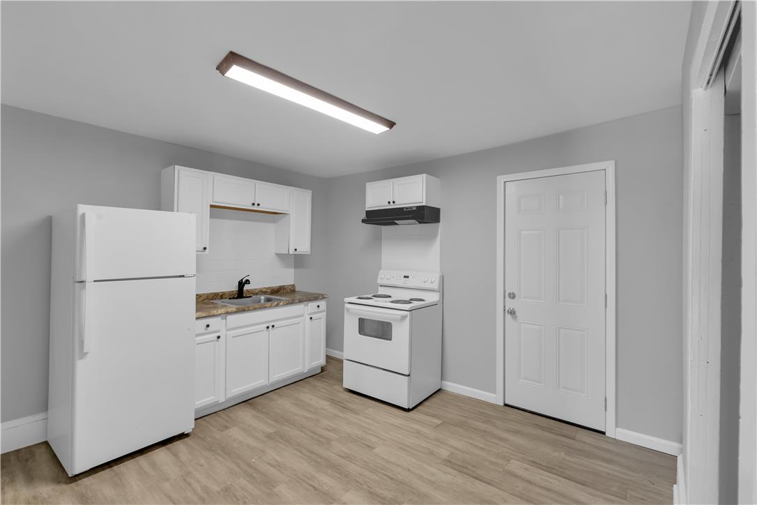 149 West Ridge Street, Unit 1B Lansford, PA 18232 - Photo 5 of 14 A well-appointed kitchen features modern appliances and ample cabinet space for effortless living.