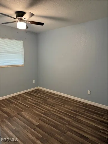 a view of room with wooden floor