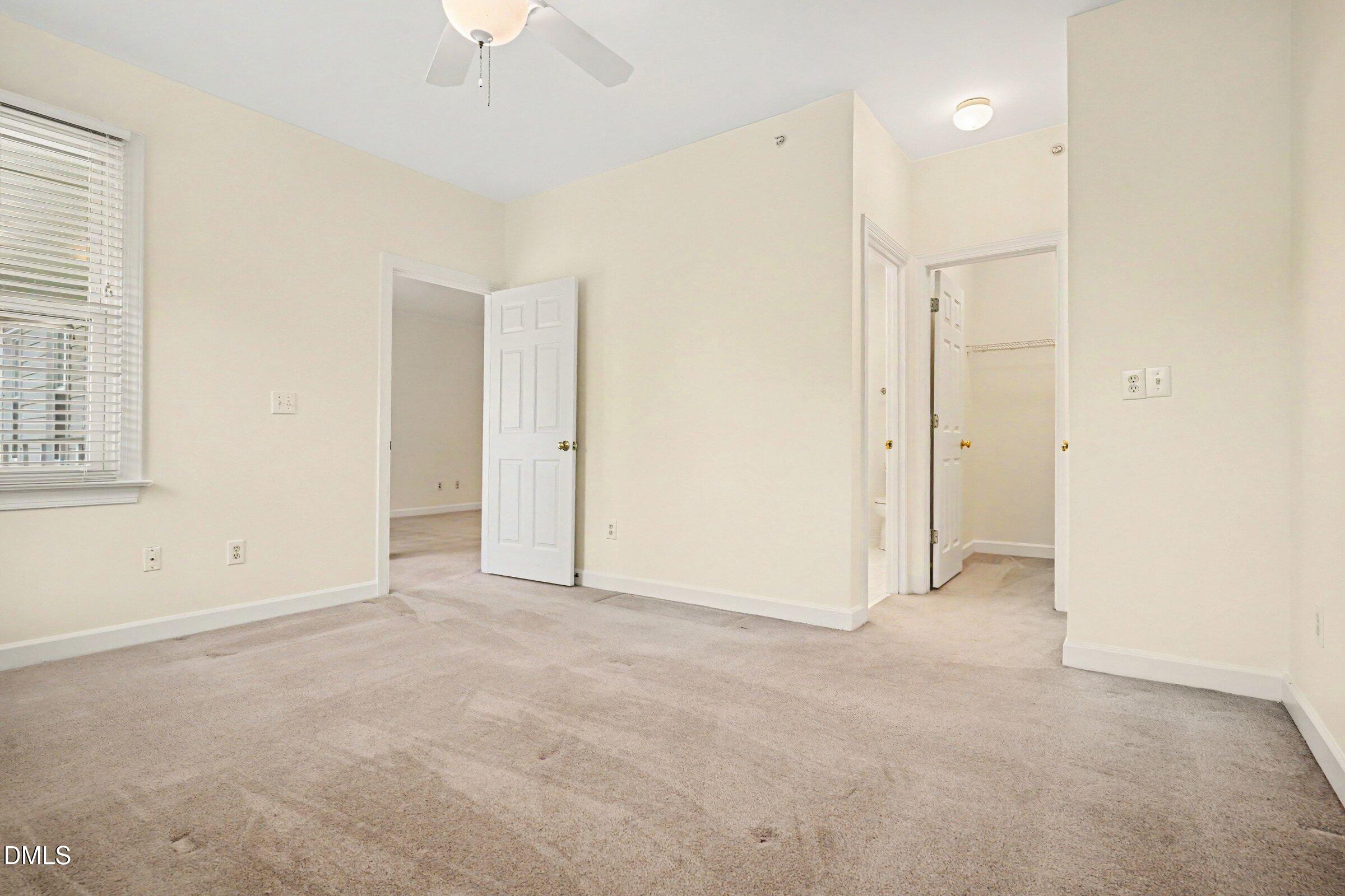 2651 Mellowfield Drive, Unit 203 Raleigh, NC 27604 - Photo 11 of 32 an empty room with windows and fan