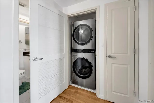 a view of a hallway with washer and dryer